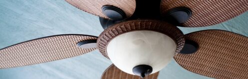 Decorative ceiling fan on porch of home.
